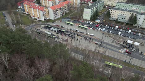 Drone-view-of-a-tram-loop-with-a-crowd-of-people