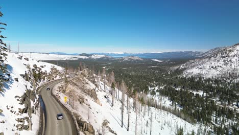 Aerial-view-of-bluebird-mountain-highway-and-valley,-Lake-Tahoe,-California