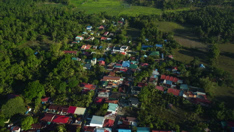 Vibrant-countryside-homes,-golden-hour-in-the-Calabarzon-region-of-Luzon,-Philippines---Aerial-view