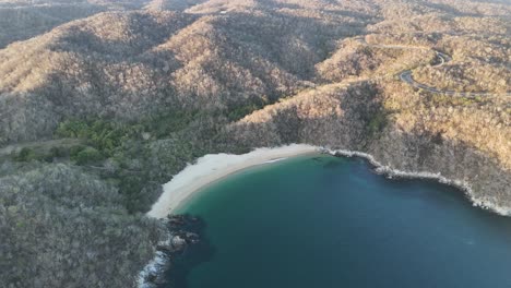 Aerial-view-of-Bahía-El-Organo-at-dusk-in-Huatulco,-Oaxaca,-filmed-by-drone