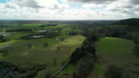 Springtime-aerial-drone-flyover-the-Cheshire-Plains-from-Beeston,-England,-UK