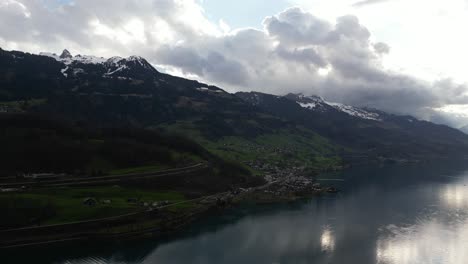 Aerial-shot-of-hills-under-clouds-in-Walensee,-Switzerland