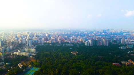 Panoramic-Revealing-Aerial-of-Dhaka-City-and-Ramna-Park,-Bangladesh