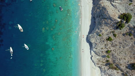 Aerial:-Top-down-drone-shot-of-Lalaria-beach-in-Skiathos-island,-Sporades,-Greece-with-turquoise-water