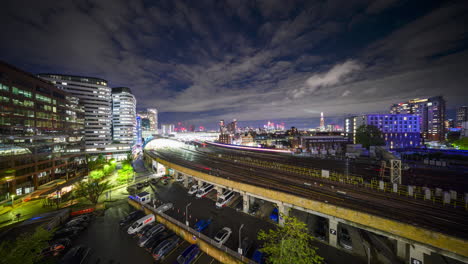Trains-arriving-and-departing-from-London-Waterloo-station-at-night-in-time-lapse-from-a-vantage-point-in-wide-angle
