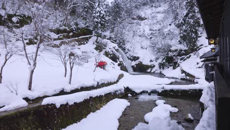 Ginzan-Onsen,-Ryokan-in-Japan-with-View-of-Waterfall-and-Snow