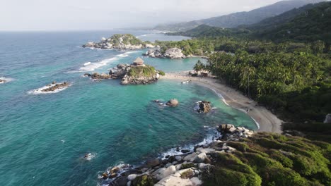 Aerial-panorama-of-Tayrona's-Cabo-San-Juan,-a-coastal-jewel,-Colombia