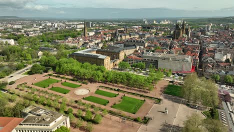 Aerial-Orbit-of-Metz-City-and-Esplanade-Gardens-on-a-Sunny-Day,-France