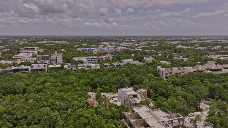 Tulum-Mexico-Aerial-v4-drone-flyover-luxury-neighborhood-capturing-views-of-La-Veleta-and-town-center-with-construction-of-new-properties-and-ocean-views---Shot-with-Mavic-3-Pro-Cine---July-2023