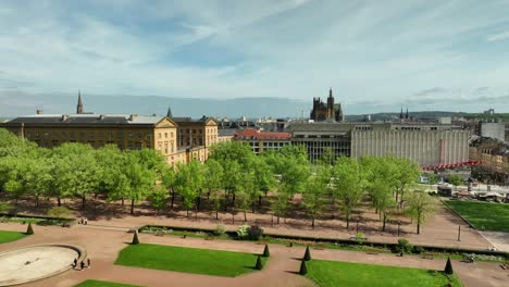 Drone-View-Flying-Over-Sunny-Esplanade-Gardens-Revealing-Metz-City