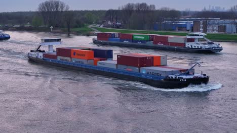 Veja-Containership-In-The-Waterways-Of-Schelda-River-In-Zwijndrecht,-Belgium