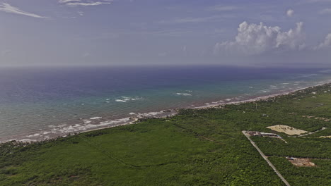 Tulum-Mexico-Aerial-v20-high-drone-flyover-capturing-breathtaking-views-of-an-oceanfront-resort-town-nestled-along-sandy-beach-with-pristine-ocean-views---Shot-with-Mavic-3-Pro-Cine---July-2023