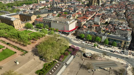 Metz-Cityscape-in-France,-Aerial-Tilt-Up-Revealing-Sunny-City