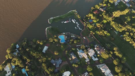 Aerial-view-of-luxury-private-neighborhood-on-the-coast-of-the-Paraná-river,-Misiones-province,-Argentina