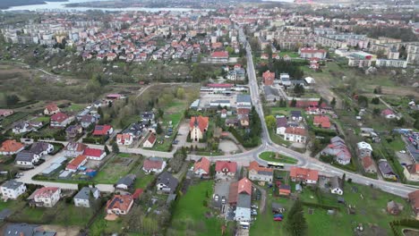 Drone-view-of-a-small-town-with-a-church-on-the-outskirts