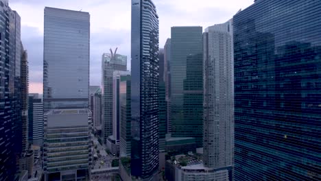 Fly-over-the-business-district-in-the-city-of-Singapore-during-the-day