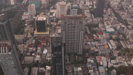 looking-down-on-urban-traffic-patterns-in-downtown-Bangkok,-the-capital-city-of-Thailand