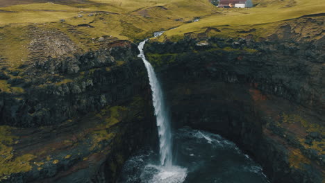 Mulafossur-waterfall,-Faroe-Islands:-fantastic-aerial-view-over-the-famous-waterfall-in-a-spectacular-setting