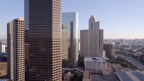 Drone-Shot,-Houston-Texas-USA-Downtown-Buildings,-Towers,-Skyscrapers-and-Traffic-on-I-45-Highway,-Gulf-Freeway