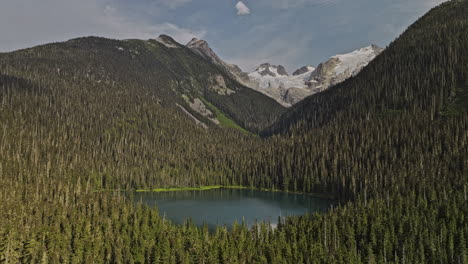 Lower-Joffre-Lake-BC-Canada-Aerial-v1-flyover-forested-valley-capturing-nature-beauty-of-Canadian-wilderness,-pristine-lake,-mountains-and-glacier-capped-peaks---Shot-with-Mavic-3-Pro-Cine---July-2023