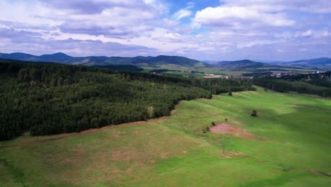 Landscape-of-Serbia,-Aerial-View-of-Zlatibor-Mountain-Resorts-Green-Fields-and-Pine-Forest