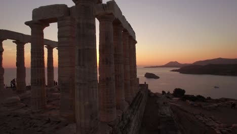 aerial-drone-close-up-of-Temple-of-Poseidon-,-Sounion-Greece-at-golden-hour