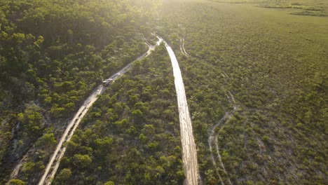 Aerial-clip-of-4x4-driving-slowly-in-remote-outback-Australia,-late-afternoon-on-bush-track,-clip-four