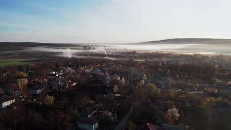 A-foggy-morning-in-a-small-town-with-houses-and-trees