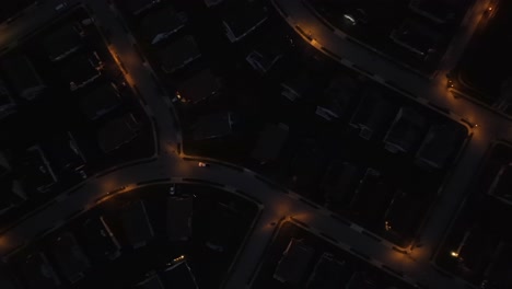 High-aerial-top-down-shot-above-street-with-lights-at-night
