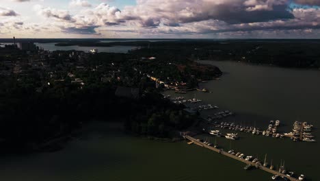 Aerial-view-around-the-church-and-old-town-Naantali-harbor,-summer-in-Finland