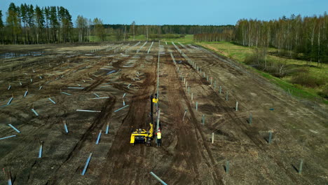 Aerial-View-Of-A-Working-Solar-Pile-Driving-Equipment-In-The-Fields