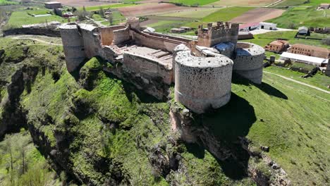 Aerial-drone-view-flying-backward-of-Berlanga-de-Duero-Castle,-in-Soria,-Spain