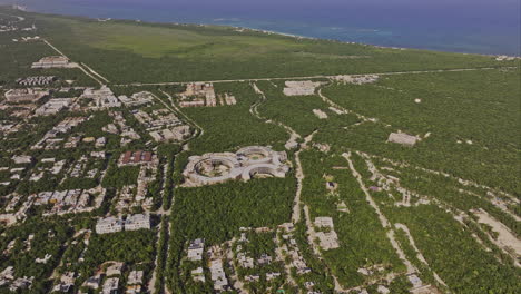 Tulum-Mexico-Aerial-v15-high-birds-eye-view-drone-flyover-residential-neighborhood-and-resort-town-center-capturing-coastal-landscape-and-Caribbean-ocean-views---Shot-with-Mavic-3-Pro-Cine---July-2023