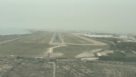 Unique-real-time-landing-in-the-middle-of-a-sandstorm-in-the-coastal-Almeria-airport,-Spain