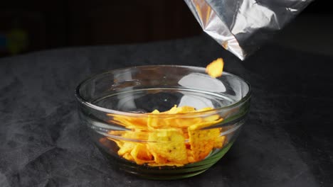 Tortilla-Chips-closeup-studio-shot-fall-into-glass-bowl-Mexican-food-appetizer