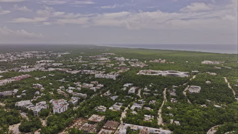 Tulum-Mexico-Aerial-v6-high-rising-flyover-luxury-neighborhood-capturing-the-panoramic-views-of-new-construction-developments,-town-center-and-La-Veleta---Shot-with-Mavic-3-Pro-Cine---July-2023