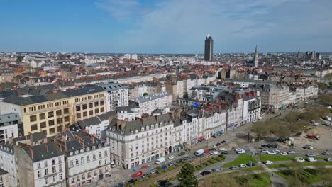 Aerial-drone-flying-over-Nantes-city-with-Tour-Bretagne-or-Brittany-Tower-in-background,-France