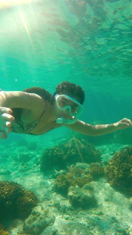 Woman-Snorkeling-Underwater---Vertical-Shot