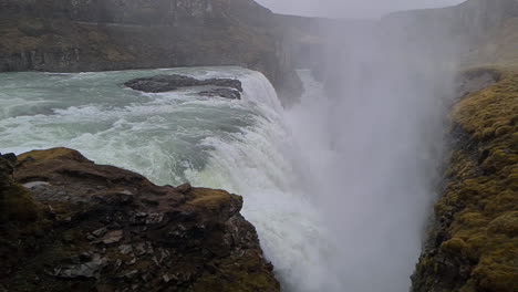 Gullfoss-Waterfall,-Natural-Landmark-of-Iceland,-Slow-Motion-of-Falling-Water-and-Mist