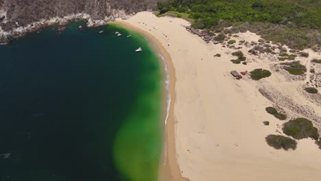 Aerial-drone-shots-of-Cacaluta-Bay-in-Huatulco,-Oaxaca