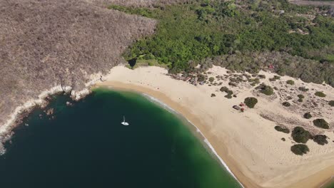 Sands-of-Cacaluta-Bay,-nestled-within-Huatulco-nine-bay-expanse,-Oaxaca,-Mexico