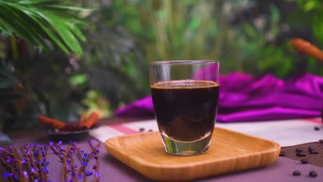 Close-up-view-of-a-glass-with-dark-coffee-or-tea