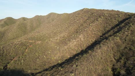 Drone-shot-over-the-arid-mountains-of-coastal-Santa-Marta,-Colombia