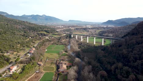 Aerial-Drone-View-From-Castellfollit-De-La-Roca:-The-Cliffside-Town-In-Girona’s-Pyrenees,-Near-Garrotxa-Volcanic-Zone