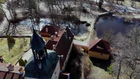 Aerial-drone-view-of-medieval-Lielstraupe-Castle-in-Straupe-Village,-Vidzeme,-northern-Latvia