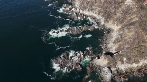 Rugged-rocks-and-cliffs-along-the-Mexican-Pacific,-near-Huatulco-Oaxaca