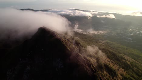 Scenic-Clouds-Over-Mount-Batur-Peak-During-Sunrise-In-Bali,-Indonesia