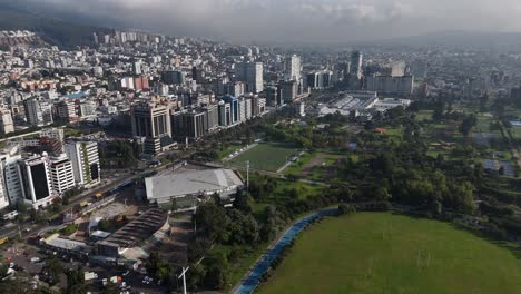 Aerial-drone-video-view-footage-of-Qutio-early-morning-sunrise-capital-city-of-Ecuador-La-Carolina-Park-traffic-Catedral-Metropolitana-de-Quito-south-american-skyline