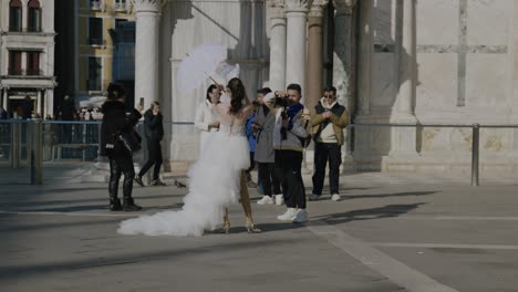 Bride-posing-for-photographers-in-Venice