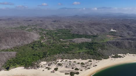 Sandy-shores-bordering-Cacaluta-Bay,-nestled-in-Huatulco's-nine-bay-panorama,-Oaxaca,-Mexico